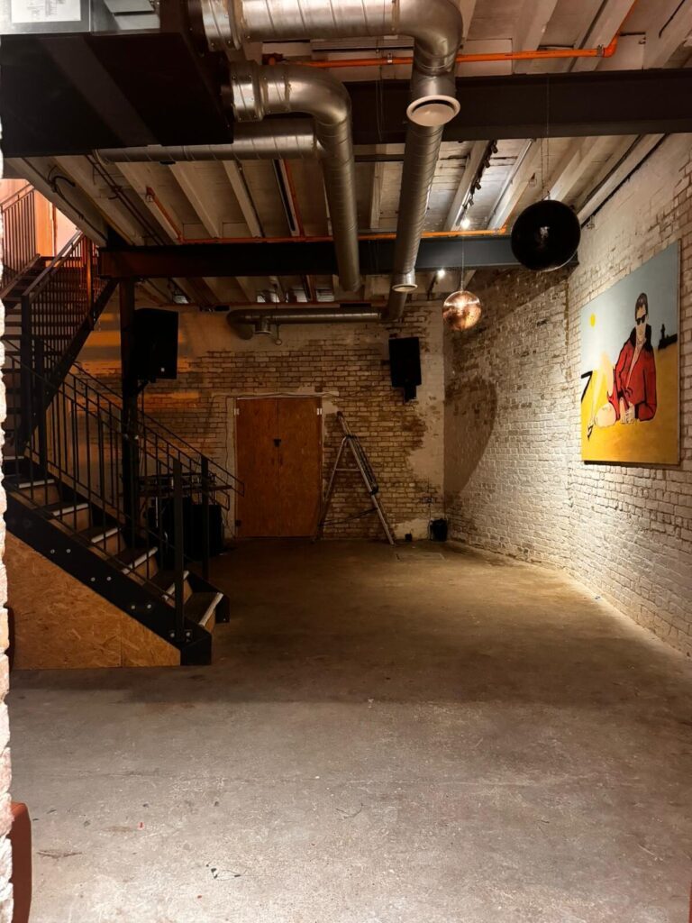 The basement at HOFFS, Margate — exposed brick, disco ball, empty ahead of a workshop